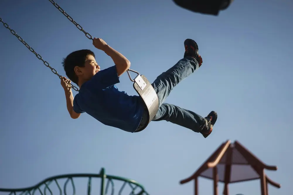 Kid on a swing